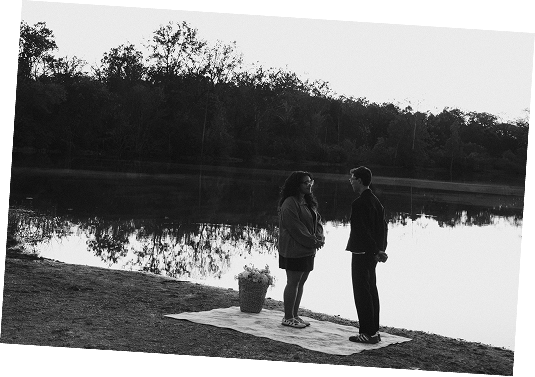 Daniel and Luzmarie together beside a quiet lake